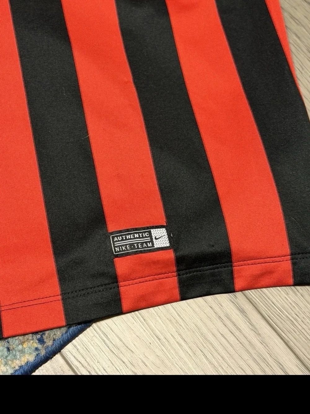 Nike Red and Black Striped Soccer Jersey with ETI Logo
